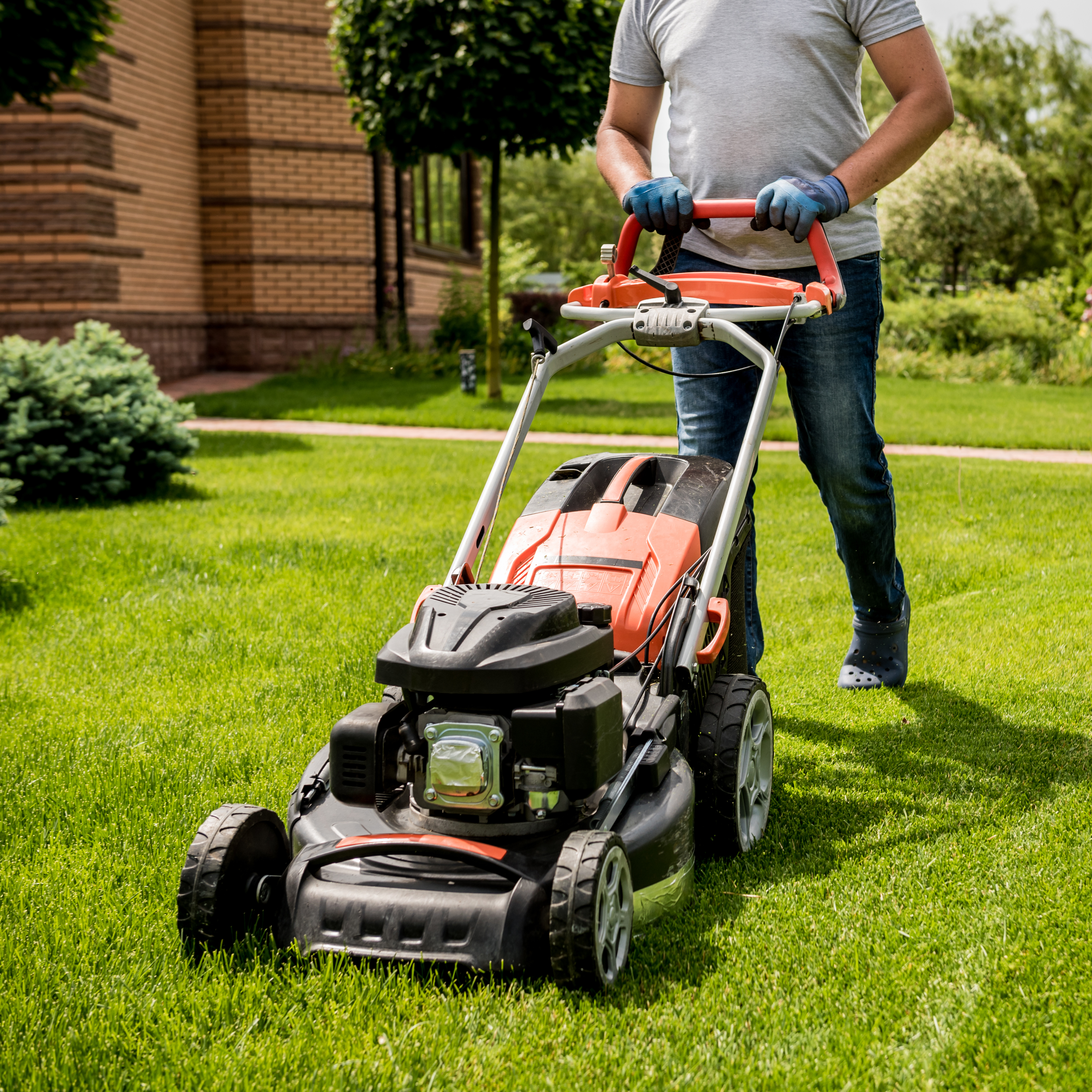 A mower cutting grass.